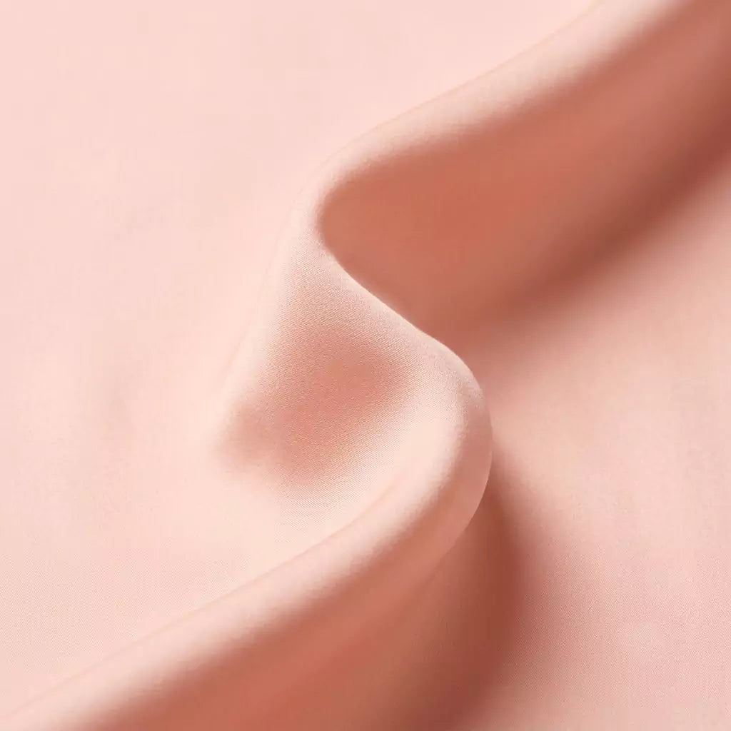 Macro close-up of silky smooth 100% TENCEL™ Lyocell fabric texture Blush Petal