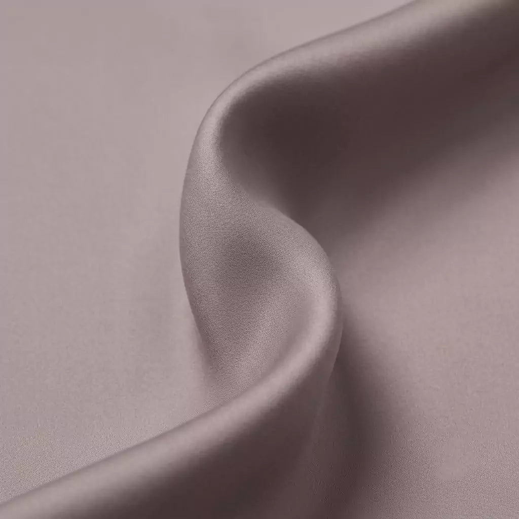 Macro close-up of silky smooth 100% TENCEL™ Lyocell fabric texture Dusty Mauve