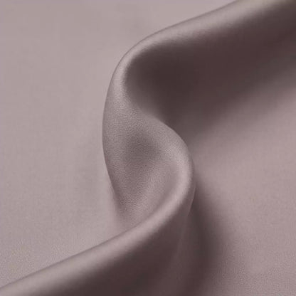 Macro close-up of silky smooth 100% TENCEL™ Lyocell fabric texture Dusty Mauve