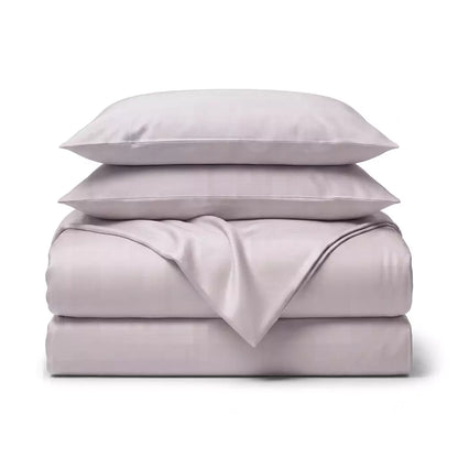 Folded 4-piece TENCEL™ Lyocell bedding set including duvet cover, fitted sheet and pillowcases Lavender_Fog