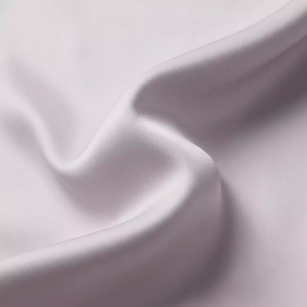 Macro close-up of silky smooth 100% TENCEL™ Lyocell fabric texture Lavender Fog
