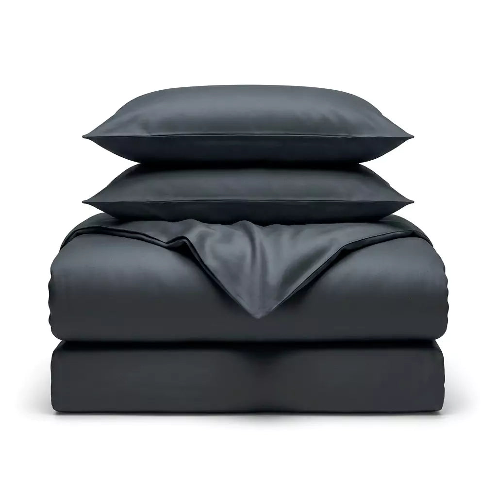 Folded 4-piece TENCEL™ Lyocell bedding set including duvet cover, fitted sheet and pillowcases Midnight Slate
