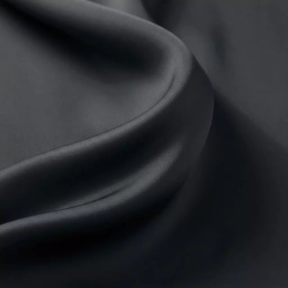 Macro close-up of silky smooth 100% TENCEL™ Lyocell fabric texture Midnight Slate