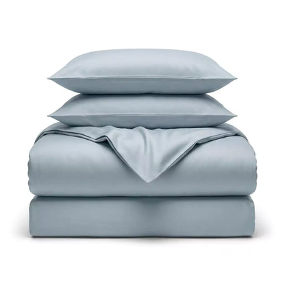 Folded 4-piece TENCEL™ Lyocell bedding set including duvet cover, fitted sheet and pillowcases Misty Blue