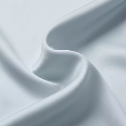 Macro close-up of silky smooth 100% TENCEL™ Lyocell fabric texture Misty Blue
